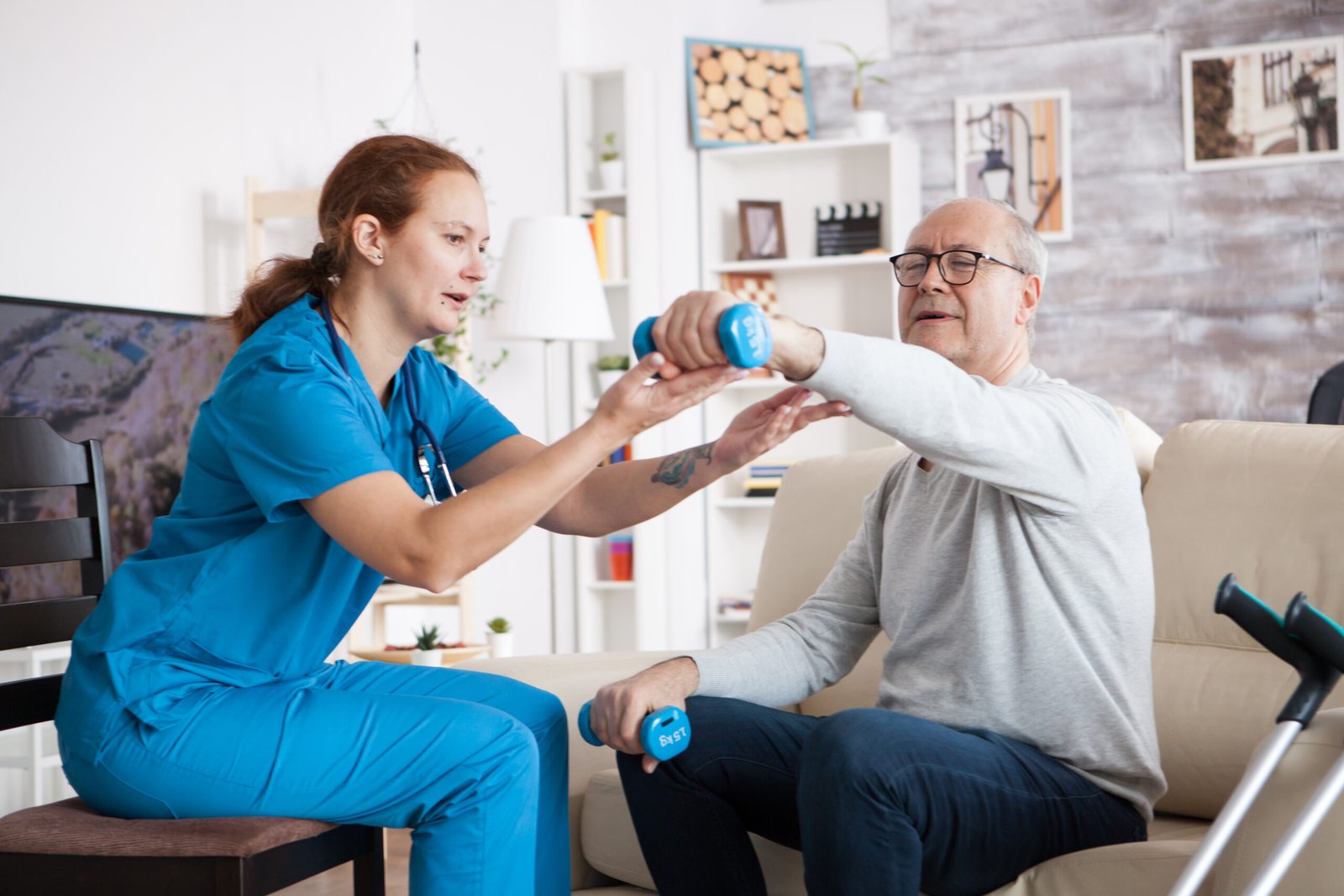 Senior man in nursing home with doing physical therapy